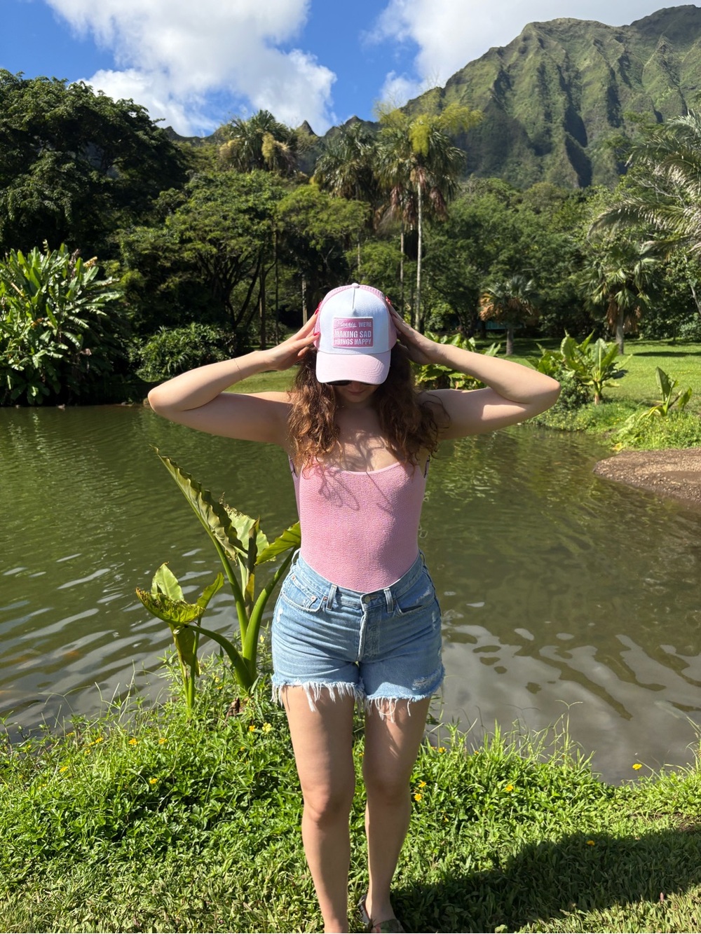 Pink and White Trucker Hat with 'Making Sad Things Happy' Patch